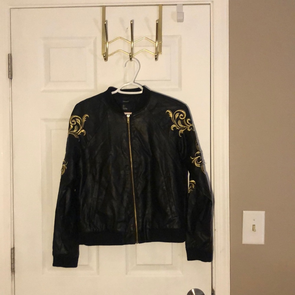Forever 21 leather jacket with gold design on each sleeve.